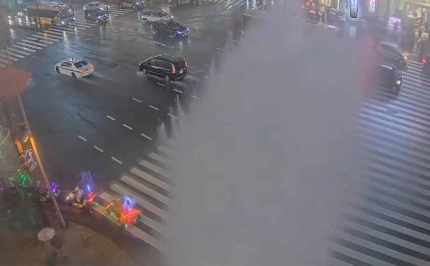 Water erupts from manhole during heavy rain in Tokyo